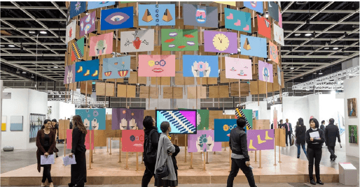 Visitors walking through a contemporary art installation